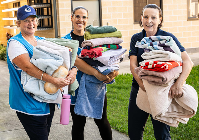 Volunteer Jacinta, pictured right, with two Corporate Experience Day volunteers.